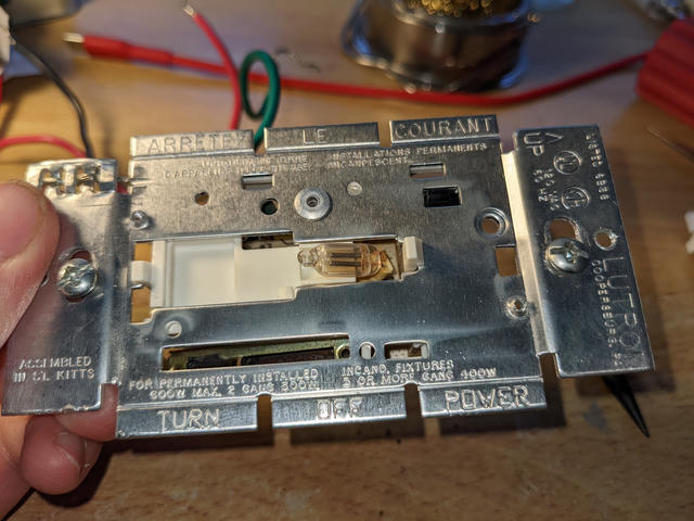 A small neon lamp illuminates the dimmer switch face, and may also have been emitting RF.